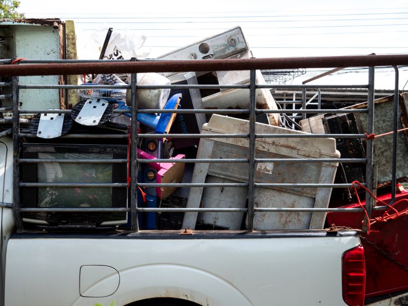 Junk Being Loaded onto Truck